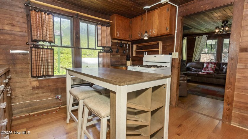 Discover a rare opportunity to own a charming 1940s mountain - photo 37