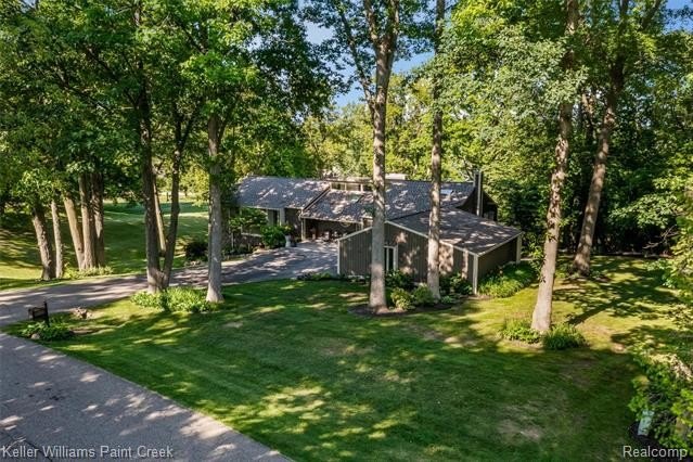 Welcome to 7148 Deerhill Drive! This striking contemporary ranch - photo 2
