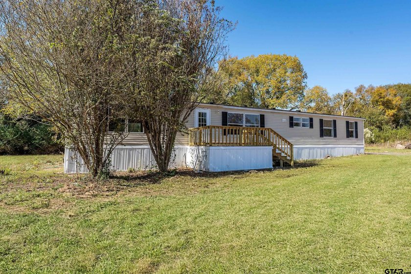 Welcome to this beautifully updated 4-bedroom, 2-bathroom mobile - photo 11