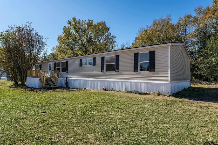 Welcome to this beautifully updated 4-bedroom, 2-bathroom mobile - photo 24