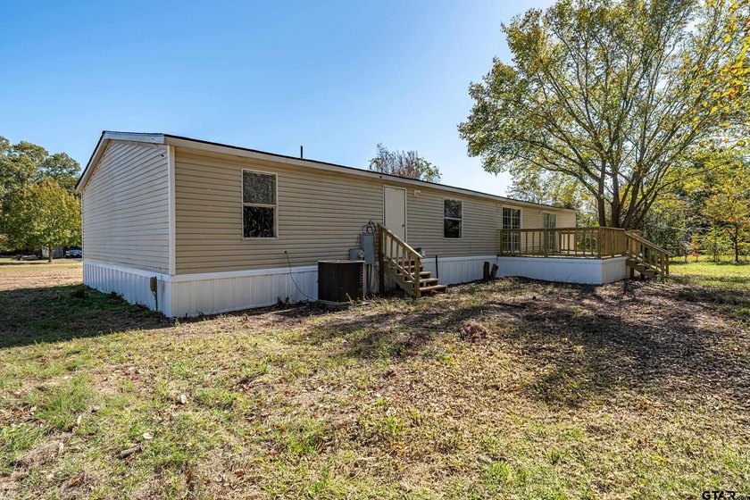 Welcome to this beautifully updated 4-bedroom, 2-bathroom mobile - photo 25