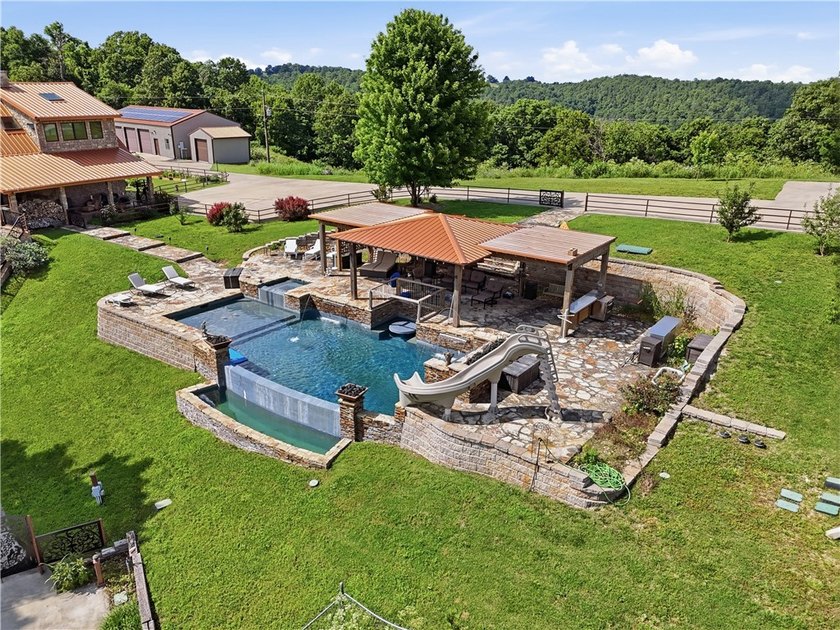 Sprawled across 9.94 acres in a gated mountain enclave, this - photo 4