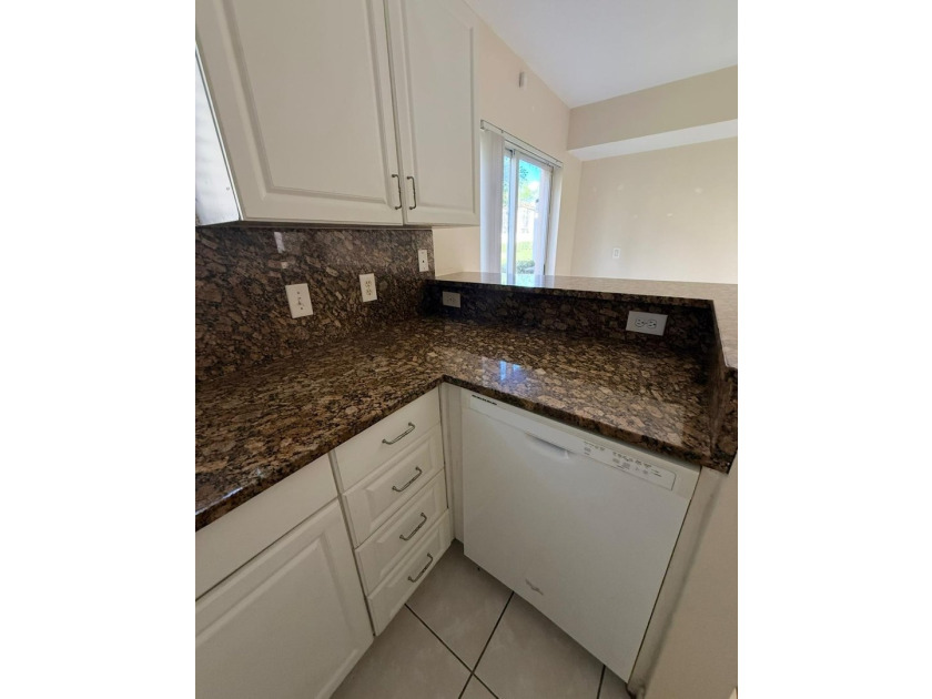 Welcome to this exceptional condominium located in the Cove at - photo 2