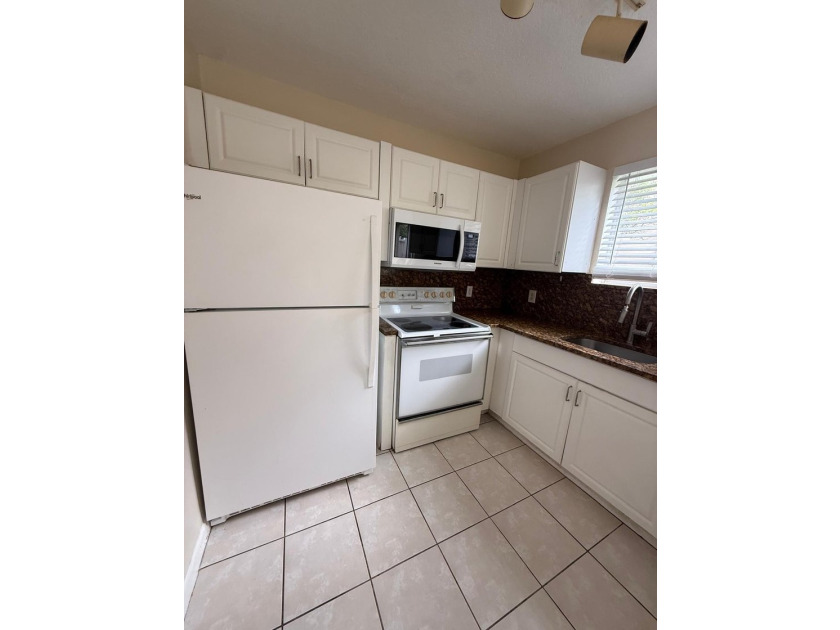 Welcome to this exceptional condominium located in the Cove at - photo 8