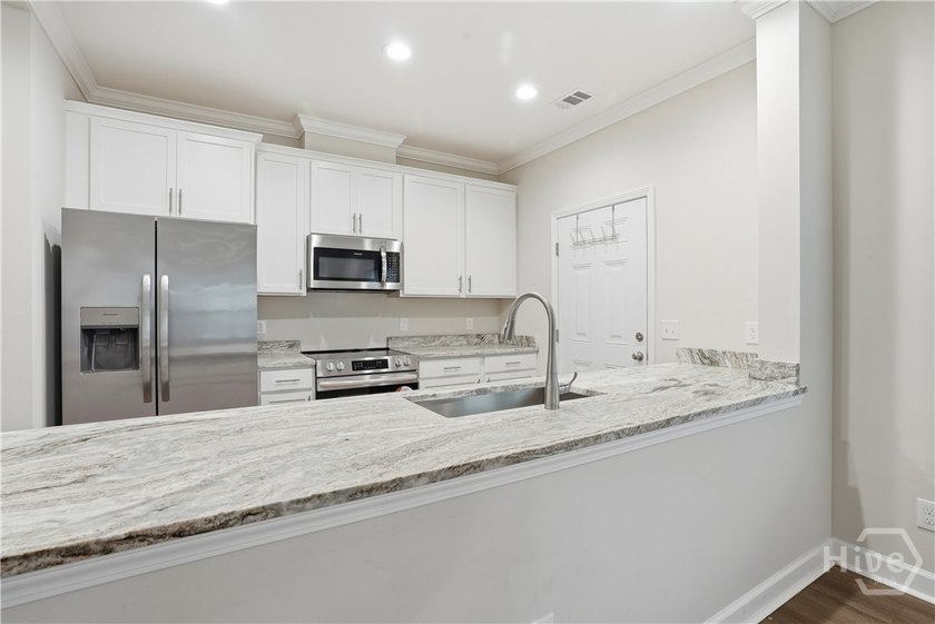 Welcome home to this beautifully built 2023 townhome that - photo 9
