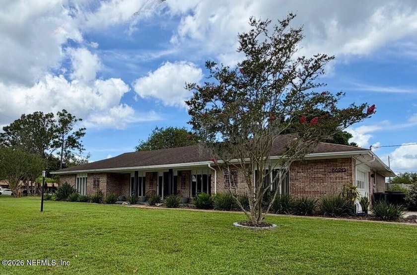 Welcome to 8620 San Servera Drive W, a beautifully updated - photo 2