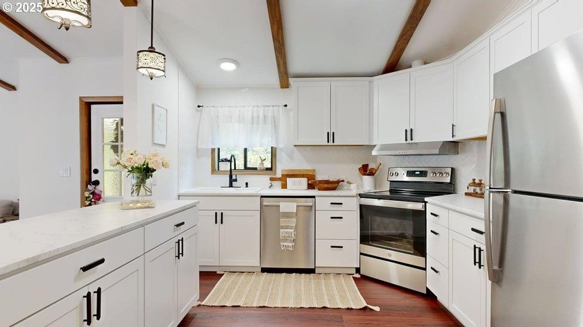 Tucked into a peaceful, wooded setting, this restored 2-bedroom - photo 9