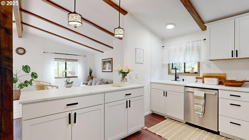 Tucked into a peaceful, wooded setting, this restored 2-bedroom - photo 10