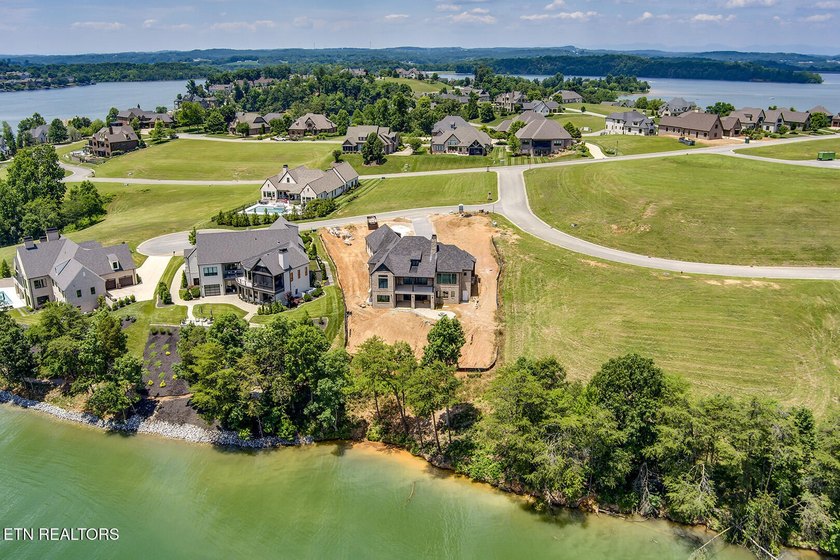 Nearly completed new construction on a premier lakefront - photo 16