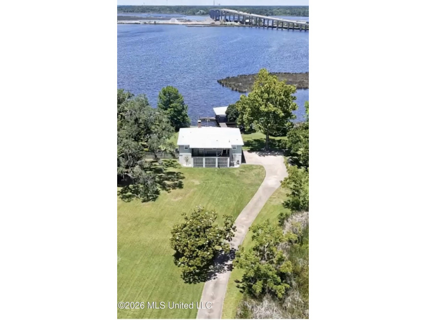 Beautiful Deep Waterfront home with a large pier and covered - photo 2