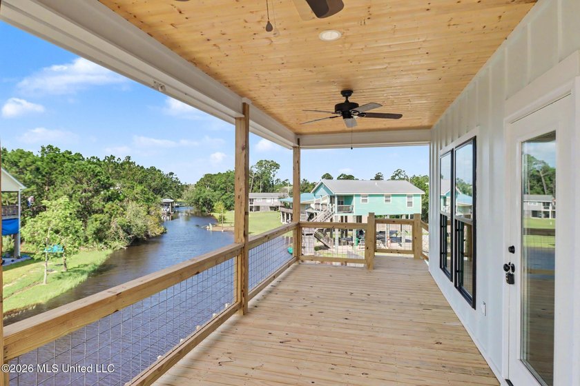 Welcome to this stunning new construction waterfront home! This - photo 3