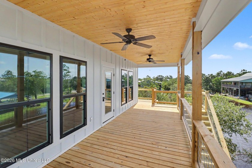 Welcome to this stunning new construction waterfront home! This - photo 4