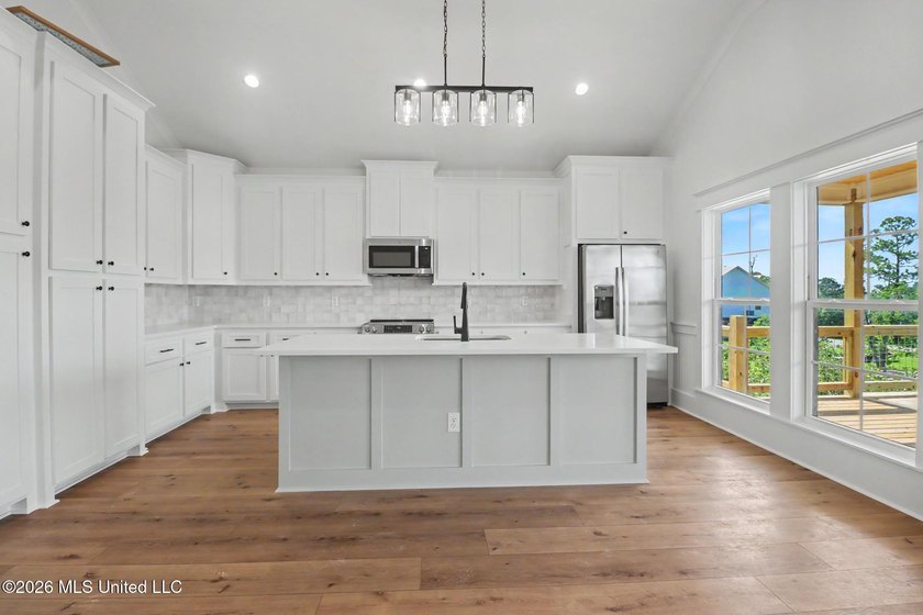 Welcome to this stunning new construction waterfront home! This - photo 6