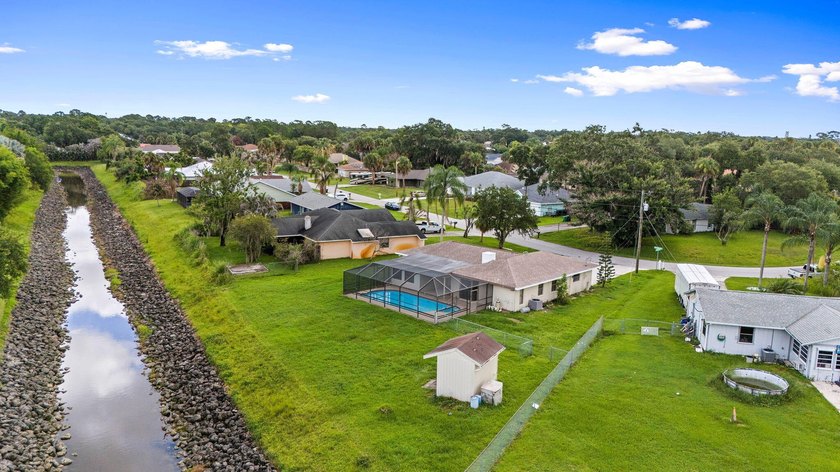 This beautifully remodeled pool home on an over sized lot is - photo 2