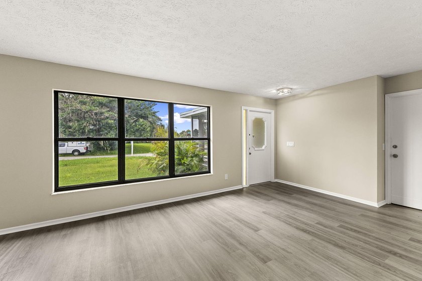 This beautifully remodeled pool home on an over sized lot is - photo 5