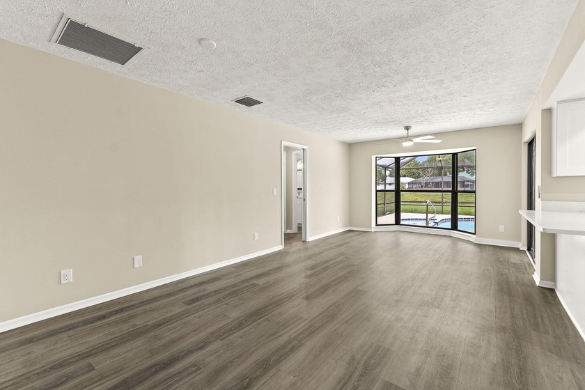 This beautifully remodeled pool home on an over sized lot is - photo 8