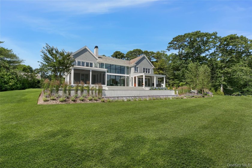Positioned on a prime stretch of waterfront in Quogue, this - photo 36