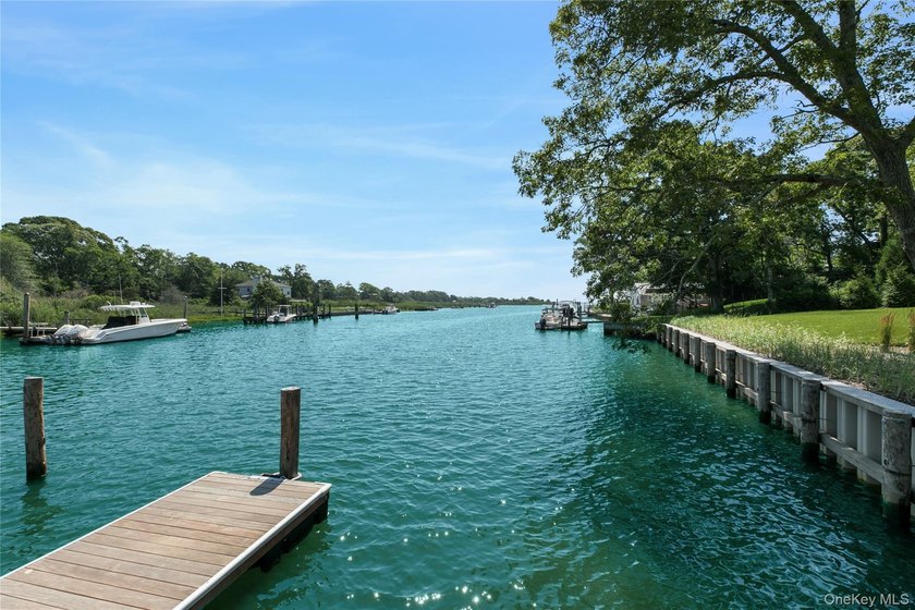Positioned on a prime stretch of waterfront in Quogue, this - photo 39
