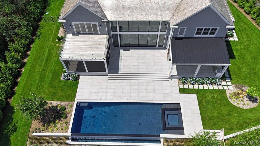 Positioned on a prime stretch of waterfront in Quogue, this - photo 44