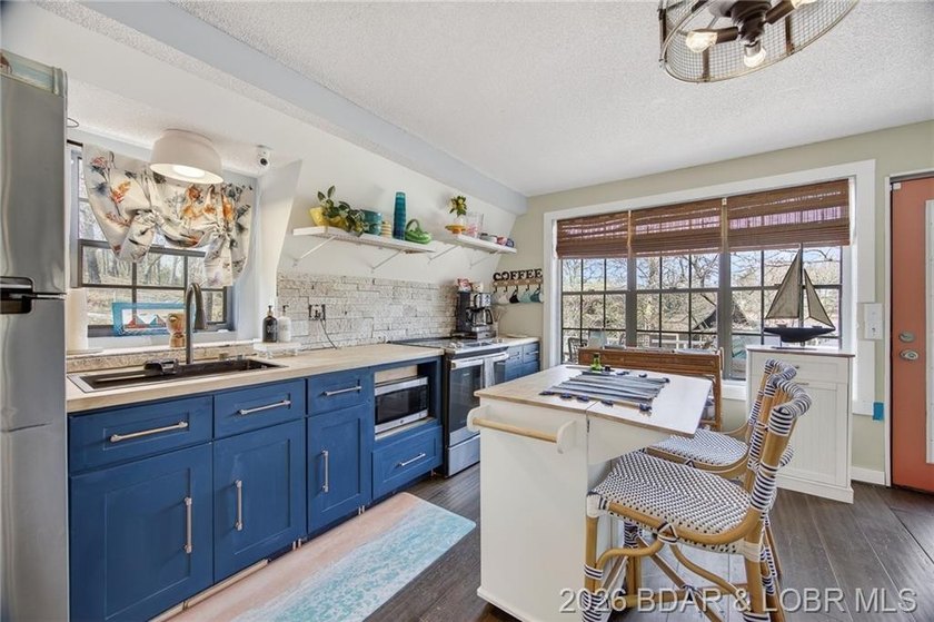 Freshly remodeled, this charming A-frame instantly feels like a - photo 11