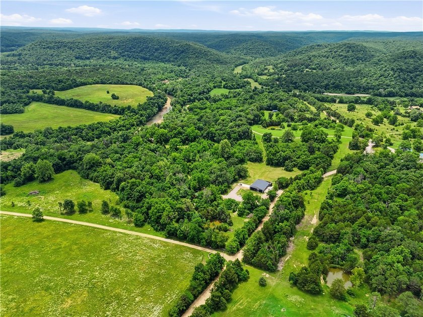 Secluded on 32.36 acres along the Kings River, this - photo 3