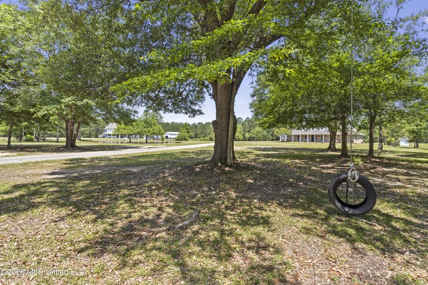Tucked behind a gated entrance on 5 private acres, this - photo 5