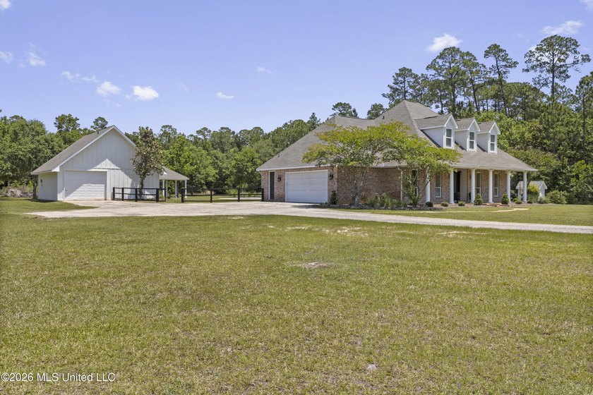 Tucked behind a gated entrance on 5 private acres, this - photo 6