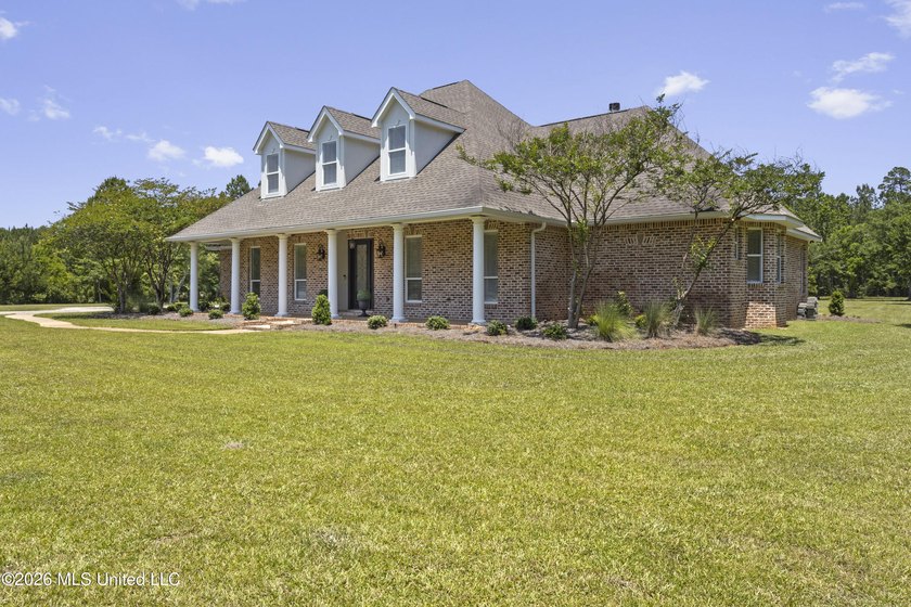 Tucked behind a gated entrance on 5 private acres, this - photo 7