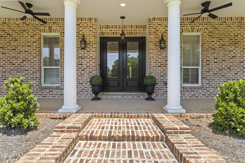 Tucked behind a gated entrance on 5 private acres, this - photo 9