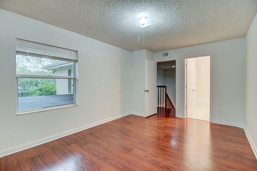 Tranquil 2-story townhouse featuring a bright, open floor plan - photo 24