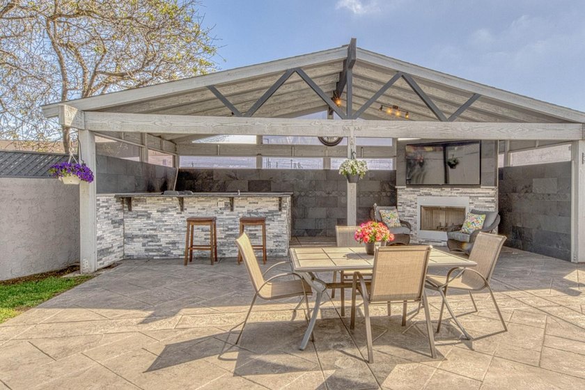 The backyard alone will sell this house. A custom covered - photo 3