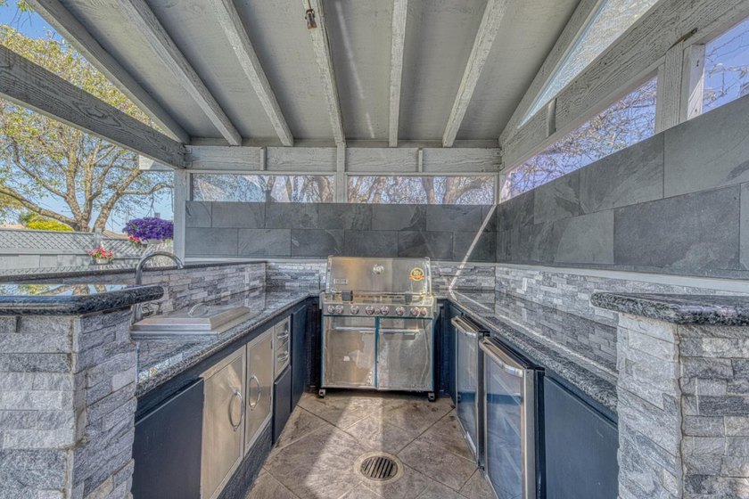 The backyard alone will sell this house. A custom covered - photo 6
