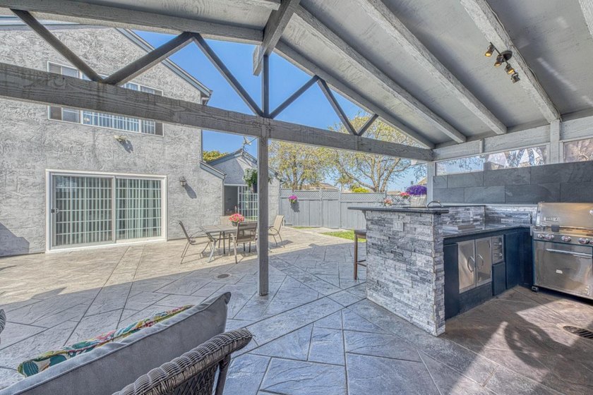 The backyard alone will sell this house. A custom covered - photo 8