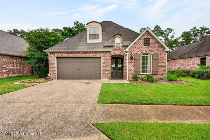 Located in the beautiful Acadian Village gated community and - photo 2