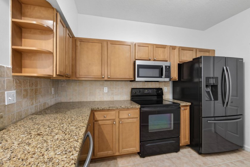 Rare Ground-Floor End Unit w/One-Car Garage In The Heart Of - photo 8