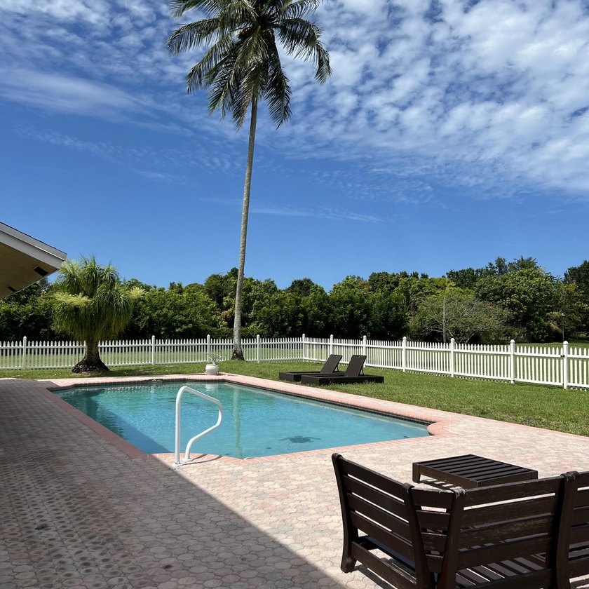 Is there a 4-bedroom home in Palm Beach County with acreage - photo 26