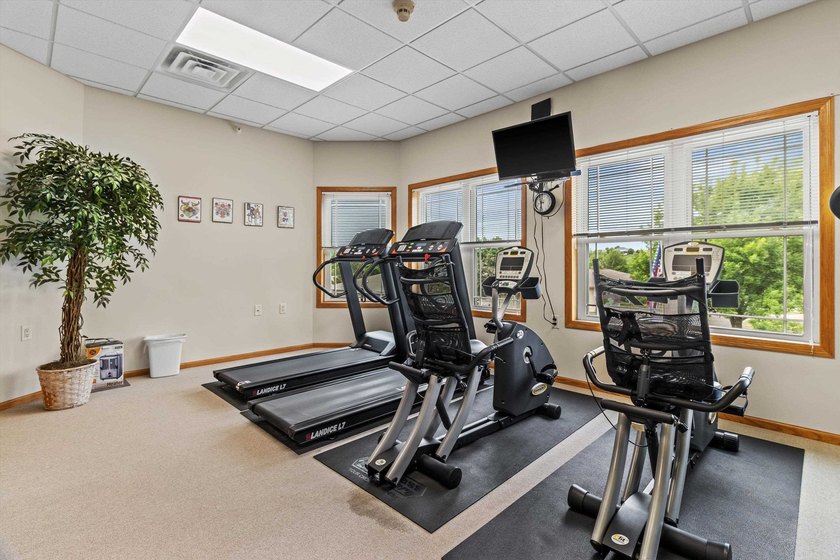 Welcome home to this bright and airy 55+ condominium in the - photo 26