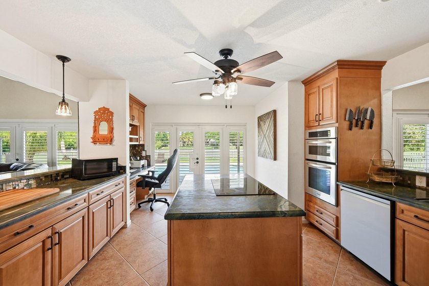 Is there a 4-bedroom home in Palm Beach County with acreage - photo 39