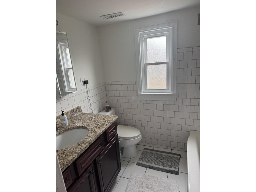 Exceptional investment opportunity or future home! This 4- - photo 11