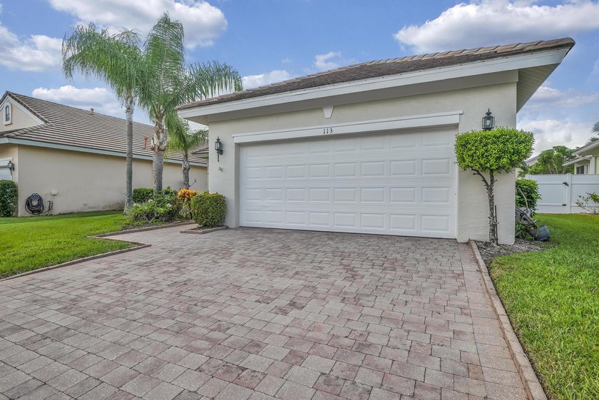Nestled in the desirable gated community of Magnolia Lakes in - photo 2