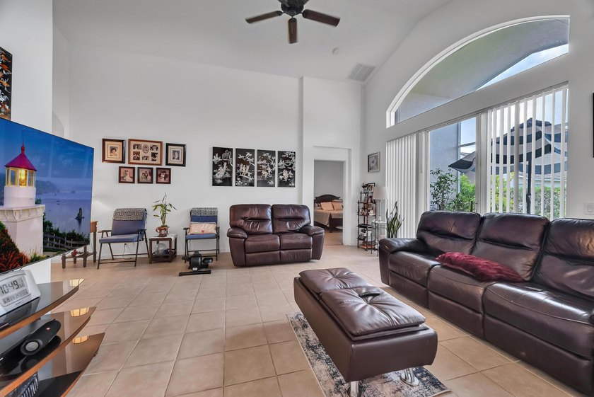 Nestled in the desirable gated community of Magnolia Lakes in - photo 6