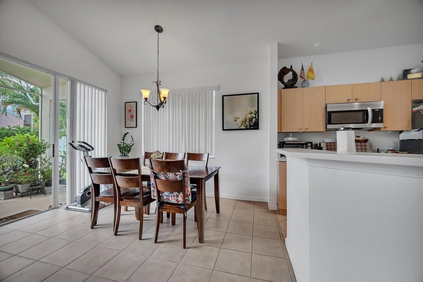 Nestled in the desirable gated community of Magnolia Lakes in - photo 7