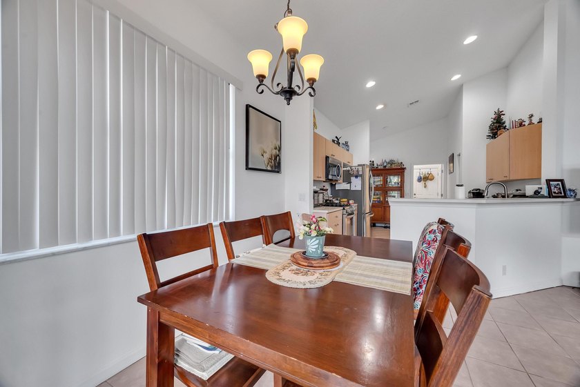 Nestled in the desirable gated community of Magnolia Lakes in - photo 8