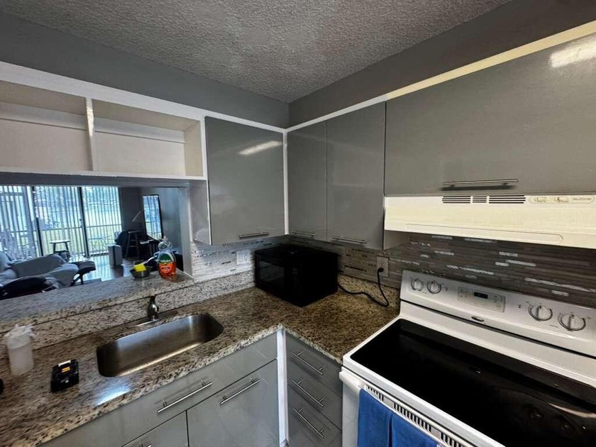 Welcome to this 2-bedroom, 2-bathroom condo located in the - photo 2
