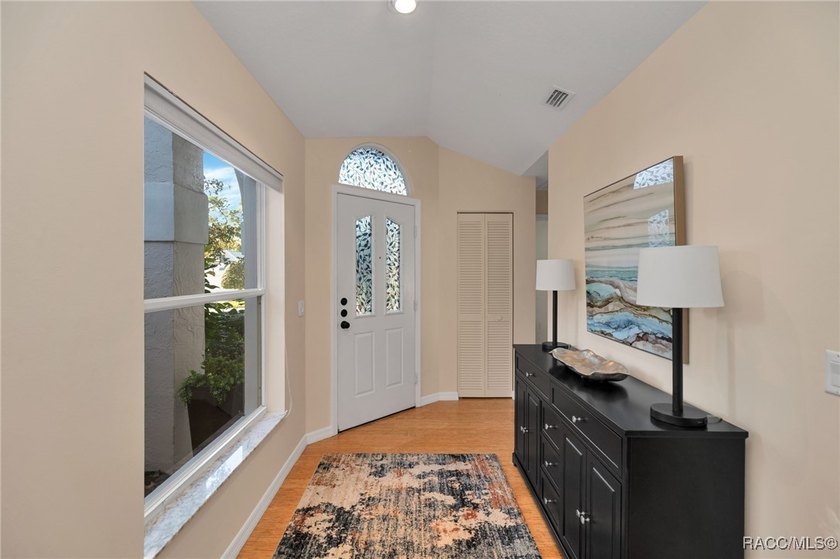 Enter to vaulted ceilings, beautiful bamboo floors in living and - photo 5
