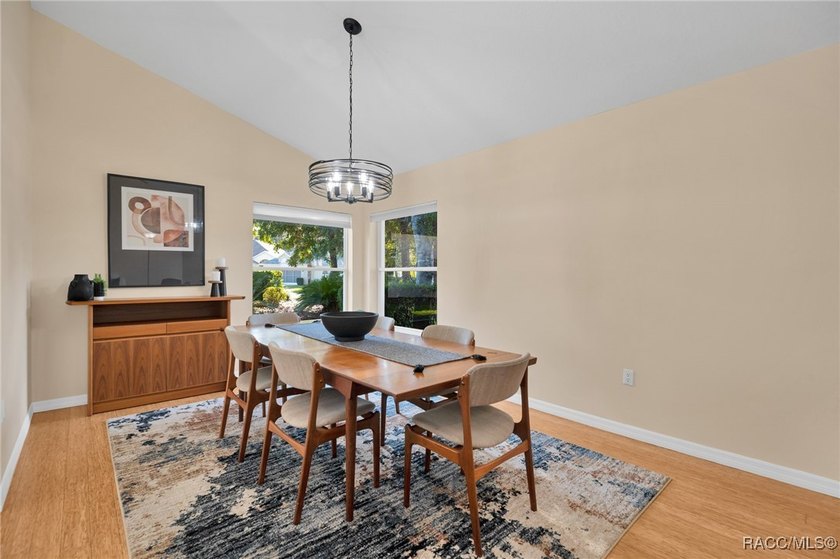 Enter to vaulted ceilings, beautiful bamboo floors in living and - photo 7