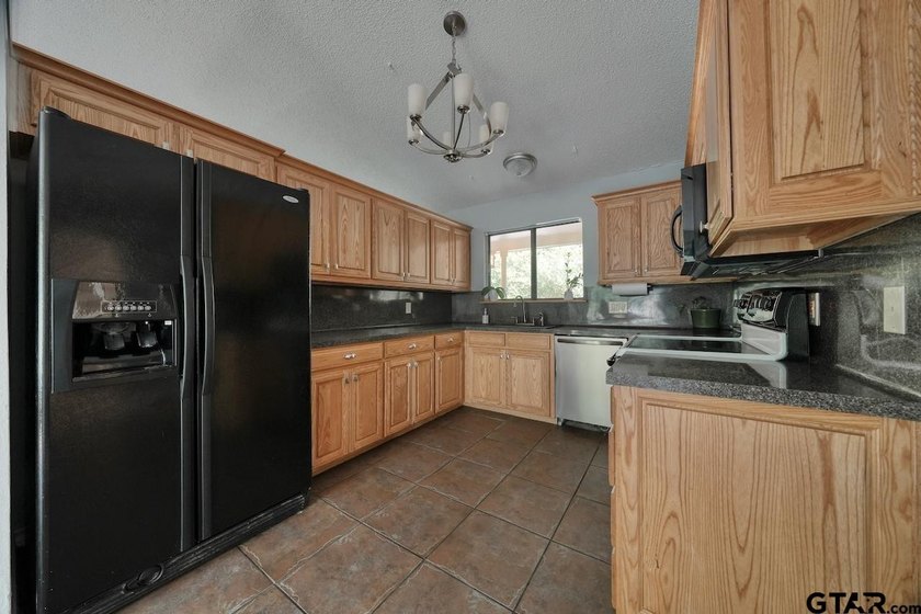 Nestled on a quiet street, this inviting residence blends - photo 12