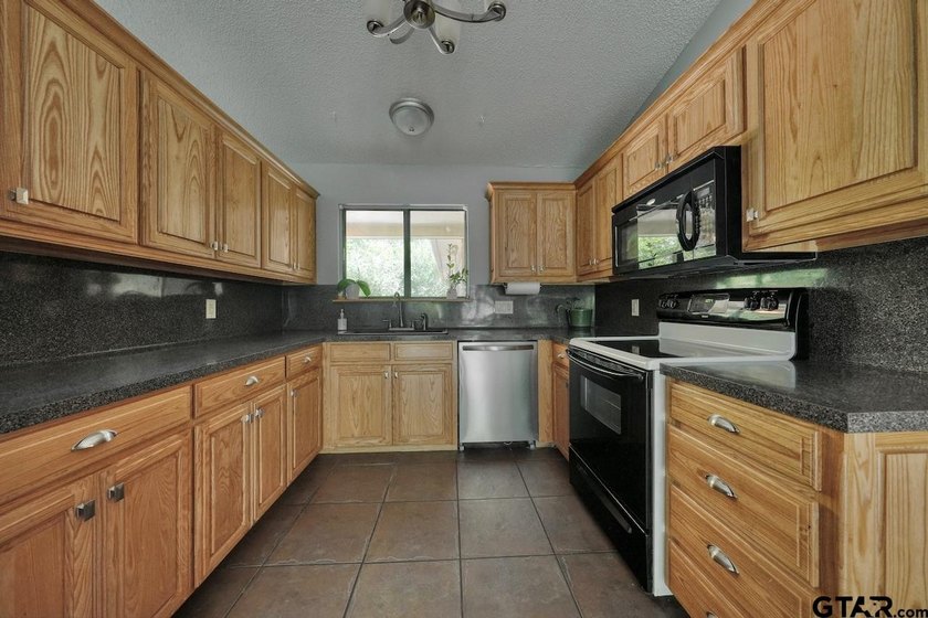 Nestled on a quiet street, this inviting residence blends - photo 13