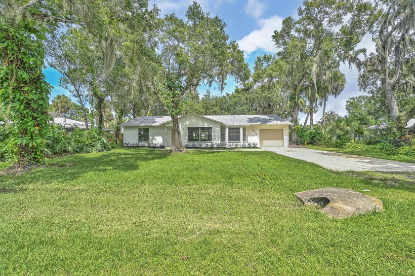 Welcome home to this beautifully remodeled residence nestled in - photo 2