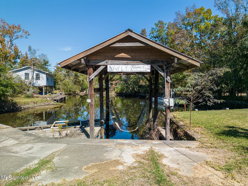 Waterfront opportunity on the Tchoutacabouffa River! This lot - photo 2